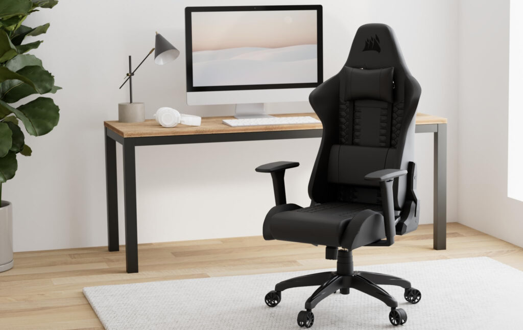 Ergonomic black gaming chair in home office setup.
